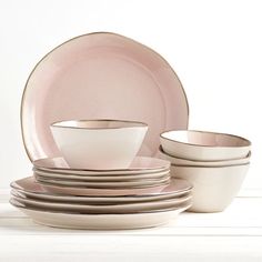 Tabletops Gallery brings subtle style and timeless elegance to your kitchen with this beautifully designed Bella Dinnerware Set. The set is perfect for enhancing your everyday table setting, featuring a lovely interior and stylish, irregular rim. Crafted from durable ceramic, this set is safe for maximum convenience in the kitchen. Color: Pink | Reactive Glaze Dinnerware Tabletops Gallery 12PC Set - BELLA Ceramic / Earthenware / Stoneware in Pink | Wayfair Pink Dinnerware Set, Cute Dishes Sets, Pink Kitchen Accessories, Dish Sets Dinnerware, Wedding Cutlery, Dishes Sets, Table Settings Everyday, Pink Dinnerware, Pink Dishes