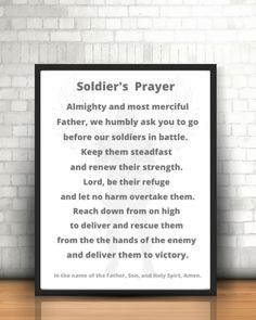 a poster with the words soldier's prayer on it in front of a brick wall