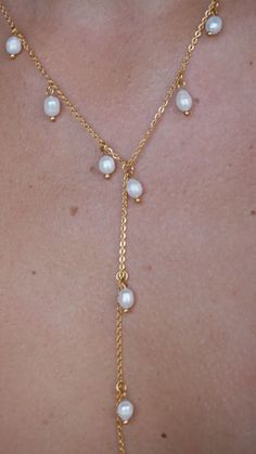 Nothing is quite as graceful as a pearl necklace. Pearl jewelry exudes class and elegance. This lariat style drop pearl necklace makes the perfect centerpiece of all your favorite outfits. Dainty chains along with dainty freshwater pearls. DETAILS: 18k Gold Plated Stainless Steel Chain Measurements: Approx 22" + 2.5" extender Imitation pearl Quality: Waterproof, Hypoallergenic, Tarnish Free 100% Eco-Friendly; No Nickel, Chromium and Lead Pearl Dangle Lariat Necklace, Pearl Lariat Necklace With Clavicle Chain, Pearl Lariat Necklace With Adjustable Chain, Elegant Lariat Pearl Necklace With Clavicle Chain, Elegant Pearl Dangle Lariat Necklace, Elegant Pearl Lariat Necklace With Dangle, Elegant Pearl Lariat Dangle Necklace, Elegant Pearl Lariat Backdrop Necklace, Elegant Pearl Charm Dangle Lariat Necklace