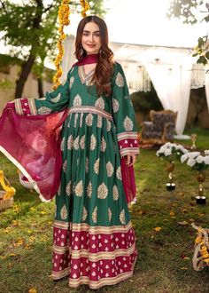 Description Shirt : Dark green and magenta long frock with front cut. Elegant all over Golden thread embroidery. Trouser : Magenta trouser Dupatta : Magenta plain dupatta.. Green Maxi Length Designer Traditional Wear, Green Anarkali Set With Dupatta And Long Sleeves, Green Chanderi Long Sleeve Sharara, Green Anarkali Salwar Kameez With Pallu, Green Long Sleeve Anarkali Set With Zari Work, Green Long Sleeve Chanderi Sharara, Green Maxi Length Sharara With Pallu, Green Long Sleeve Anarkali Set, Green Anarkali Traditional Wear With Long Sleeves