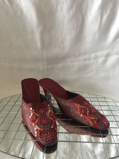 "Deeply red slippers with ornate stitching and accented with beads and sequins that can be worn for a dressy occasion as well as casual. Made By an Indian Company. There is no size marked butI tried them on and they were a little big so I am guessing a size 7. measure 10.5\"in length, 3.25\" across at the ball of the foot with a 2.5\" heel" Mercury Glass Christmas Ornaments, Women's Slip Ons, Red Slippers, Gucci Mules, Deep Red, Womens Flats, Hand Dyeing, Mule Shoe, Lounge Wear