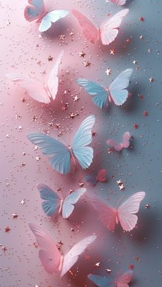 pink and blue butterflies flying in the air with glitters on it's wings