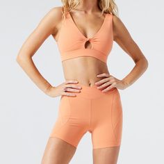 Do The Twist Sports Bra Carter Bike Shorts Size: Medium Top / Small Bottoms Color: Orange Sports Bra: Impact Level: Low Activity Type: Yoga, Barre, Walking Twist Front Keyhole Detail Double Lined Removable Pads 54% Spandex, 46% Nylon Shorts: Size: Small Impact Level: Medium/High Activity Type: Running, Cycling, Weight Training, Hiit V Front Bike Short High Waist Side Seaming And Pockets 54% Spandex, 46% Nylon Sporty Athletic Shorts For Pilates In Summer, Sporty Biker Shorts For Light Exercise In Summer, Sporty Biker Shorts For Pilates Summer, Summer Sportswear Biker Shorts For Pilates, Short Sports Bra For Yoga, Nylon Shorts, Yoga Barre, L Space, Weight Training