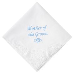 a mother of the groom handkerchief on top of a white napkin