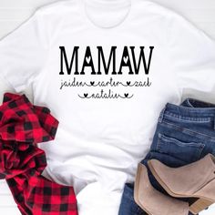 Super cute, unisex Mamaw shirt with the word, "Mamaw" and grandkid's names below with adorable hearts. Great t-shirt for a Mamaw birthday gift, Mamaw reveal gift, or a New Mamaw gift. *****Please leave personalization information of all the kid's names to put under the word Mamaw. Family Matching Custom Name T-shirt As A Gift, Family Matching T-shirt With Custom Name As Gift, Custom Name Family Matching T-shirt, Custom Name T-shirt For Family Matching Gift, Custom Name Cotton Top As A Gift, Custom Name Tops For Mother's Day Gift, Custom Name Cotton T-shirt As Gift, Custom Name Short Sleeve Tops For Gift, Custom Name Short Sleeve Tops For Gifts