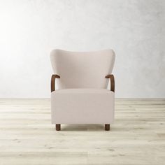 a white chair sitting on top of a hard wood floor