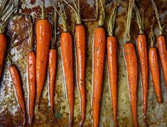 there are many carrots that have been cooked on the stove top and lined up