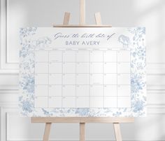 an easel with a baby's birth calendar on it