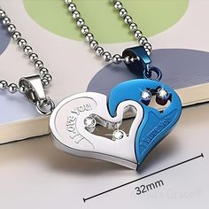 The Maya's Grace Two-Piece Stainless Steel Heart Necklace Set is a meaningful way to express your love. This couple's matching necklace features one silver half-heart puzzle pendant paired with a Blue, Silver, Gold, or Black half-heart pendant, both on a durable 20-inch silver-finish chain. Perfect as a gift for your significant other on anniversaries or special occasions, or wear both pieces together for a unique statement look. Jewelry Care: Store in a clean, dry place. Do not wear in water or Blue Necklace For Anniversary On Valentine's Day, Blue Double Heart Jewelry For Valentine's Day, Personalized Blue Necklace For Mother's Day, Couples' Silver Stainless Steel Necklaces, Silver Stainless Steel Couples Necklace, Blue Heart Pendant Necklace For Mother's Day, Personalized Blue Necklaces For Anniversary, Personalized Blue Necklace For Anniversary, Blue Personalized Necklace For Valentine's Day