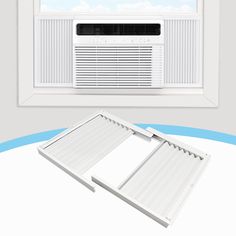 an air conditioner sitting on top of a window sill next to a window