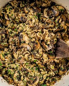 a pot filled with rice and mushrooms