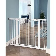 the baby gate is open and ready to be installed into the room with hardwood floors