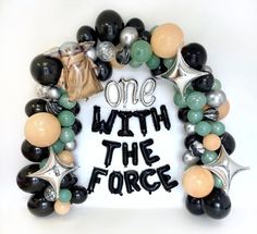 a wreath made out of balloons that says, one with the force