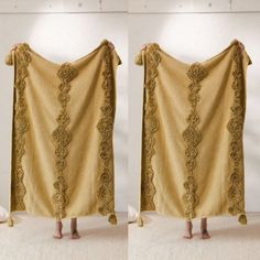 two pictures of a woman holding up a yellow blanket with lace trims on it