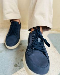 These Men's Navy Blue Sneakers offer a sleek blend of style and versatility. The premium leather upper in a rich navy hue pairs perfectly with the contrasting white sole for a modern, clean look. Designed for comfortable everyday wear, these versatile casual footwear options are perfect for everything from weekend outings to casual Fridays at the office. Experience the ideal balance of fashion and function with these essential sneakers. Sporty Navy Sneakers With Stitched Sole, Blue Sneakers With Contrast Sole, Modern Navy Sneakers With Round Toe, Navy Textured Sole Slip-on Sneakers, Navy Slip-on Sneakers With Textured Sole, Navy Leather Sneakers With Gum Sole, Navy Casual Custom Sneakers With Rubber Sole, Navy Low-top Sneakers With Textured Sole, Casual Navy Sneakers With Contrast Sole