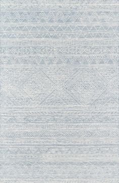 a blue and white rug with an abstract design