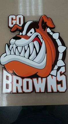 an orange and white sticker with the word browns on it