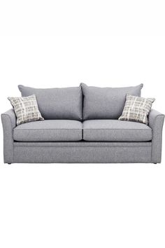 a grey couch with two pillows on it's back and one arm facing the camera