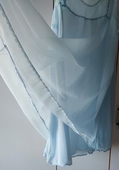 Powder blue double layer nightie, women's vintage nightgown Great vintage condition. no holes, rips, tears or stains. Reinforcement was made under the armpit with hand stitching Measurements taken while lying flat Shoulder to shoulder: 13" 33 cm Bust: 20"  51cm doubled(40") Waist: 26" 65cm Hips:  free Length: 35" 90cm Arm Hole: 9." Nightgown does not have material or size tags, please check the dimensions READY TO SHIP Please check your registered address is up to date on Etsy There is an express shipping option (need phone number) I send your orders by Turkish Postal Service with a registered number. The items will be shipped in Turkey after payment within 3-5 business days, and it normally will take 10-20 business days for delivery. Not valid time for days like pandemic If you have a que Vintage Blue Nightgown For Bedtime, Sleeveless Blue Nightgown With Lace Trim, Vintage Light Blue Summer Nightgown, Blue Sheer Sleeveless Nightgown, Blue Sheer Vintage Sleepwear, Vintage Nightgown, Women's Nightgowns, Pajama Robe, Pale Blue