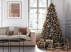 a living room with a christmas tree and presents