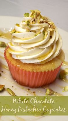 white chocolate honey pistachio cupcakes on a plate