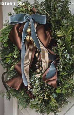 a christmas wreath hanging on the front door