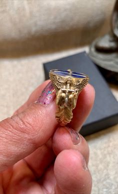 "This rare medieval style ring is handcrafted by European artisan jewelers of solid sterling silver .925 (stamp shown in photos) & Bronze. The cross is inlaid on enamel. Two embossed guardian angels hold a cross on each side of the rings band. This is an original unique design with details & art work hardly reflected in the pictures. This ring weighs 8.54 grams. Width is 0.67\". Ring size is 10 The Templars, were among the most famous of the Western Christian military orders. The organiz Christian Military, Military Orders, Glass Wind Chimes, Bird Beads, Medieval Style, Guardian Angels, Crimson Red, Medieval Fashion, Enamel Ring