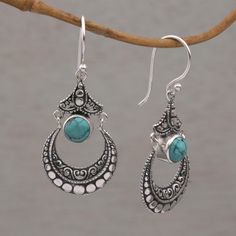 These dangle earrings are handcrafted of sterling silver by Balinese artisan Wirabhuwana to feature crescent shapes with circle and curl motifs. Each earring cradles a round cabochon of blue-green magnesite. Sterling silver, dyed magnesite Hook earrings Combination finish Color(s) may vary slightly Due to the natural materials in this item, colors may vary slightly Paw Print Jewelry, Ribbon Jewelry, Key Pendant Necklace, Jewelry Workshop, Printed Jewelry, Earrings Elegant, Silver Dangle Earrings, Sterling Silver Dangle Earrings, Key Pendant