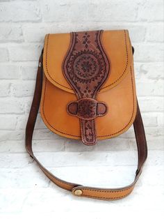 womens accessories womens Bags cross body bag leather Bag Saddle Bag leather shoulder bag Crossbody bag leather crossbody handbag Boho bagHandbags for holidays, meetings and celebrations.The bag is in nice vintage condition Size : 11.4" (29cm)* 10.2" ( 26 cm)Materials -leather.The color on the pictures may vary due to monitor settings and light reflections.We appreciate your patience.Thank you so much for looking at my works!Please do not hesitate to contact with me for any questions.See you. Crossbody Leather Shoulder Bag With Leather Lining, Leather Crossbody Shoulder Bag With Leather Lining, Leather Satchel Shoulder Bag, Leather Shoulder Bag With Mobile Phone Pocket, Saddle Bag With Adjustable Strap For Daily Use, Daily Saddle Bag With Adjustable Strap, Leather Shoulder Saddle Bag With Phone Pocket, Leather Satchel Saddle Bag, Brown Leather Shoulder Bag With Mobile Phone Pocket