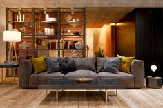 a living room filled with lots of furniture next to a wall mounted bookshelf