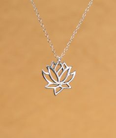 Silver lotus necklace - gold lotus flower - yoga necklace - blooming flower - a little lotus flower on a sterling silver chain This simple and classy, solid sterling silver lotus hangs from an 16 inch sterling silver chain. Please feel free to select a different length chain if you prefer! These beauties are also available in matte and shiny gold vermeil. Here is a link to the larger version :) https://www.etsy.com/listing/154068753/lotus-necklace-gold-lotus-flower?ref=shop_home_listings Need a Delicate Silver Necklace For Meditation, Dainty Flower Pendant Jewelry For Meditation, Holistic Silver Necklace With Flower Pendant, Sterling Silver Lotus Flower Jewelry In Silver, Sterling Silver Jewelry With Lotus Flower Shape, Yoga Necklace, Lotus Necklace, Gold Lotus, Blooming Flowers