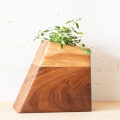 a wooden planter sitting on top of a table