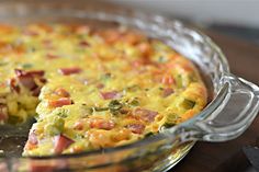 a casserole dish with ham and cheese on it