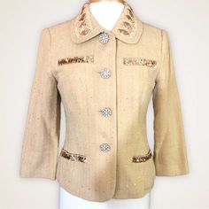 This Vintage Jacket Is So Beautiful And In Pristine Condition Like It Was Never Worn! The Fabric Is A Gold Hue With Flecks Of Gold Texture. 4 Front Pockets With Gold Sequined Tabs Collar Is Embroidered And Sequined And Round. The Buttons Are Gorgeous Rhinestone And Gold Short Cropped Hemline Excellent Pre-Loved Condition With No Flaws. Size 8, Measurements In Photos. Professional Seller. Packaged With Care. Ships Same/Next Day. Offers Welcome! Save More With Bundles. Black Tie, Formal Wear, Even Tailored Long Sleeve Embellished Outerwear, Tailored Embellished Outerwear, Festive Classic Long Sleeve Outerwear, Classic Long Sleeve Festive Outerwear, Festive Fitted Beige Outerwear, Festive Beige Fitted Outerwear, Fitted Beige Outerwear For Festive Season, Tailored Embellished Spring Outerwear, Vintage Formal Outerwear For Festive Occasions