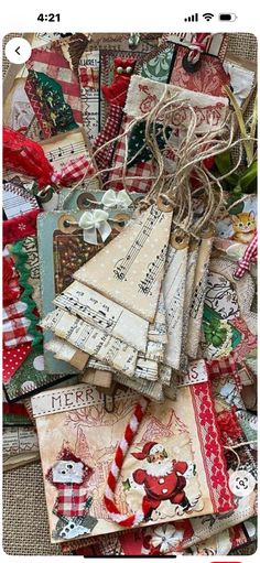 a pile of christmas cards with tags attached to them