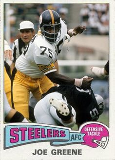 a football card with an image of a player in the middle of a tackler