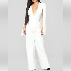 Fashion Nova Woman Of Many Talents Jumpsuit Color: Ivory Size: Xs Nwt Cape Sleeve Jumpsuit Wide Leg Deep V Neck Zipper Front Single Button Closure Lined Moderate Stretch 34 Inseam Self: 100% Polyester Lining: 100% Polyester Fitted White V-neck Jumpsuits And Rompers, White Long Sleeve Jumpsuits For Night Out, Elegant White Long Sleeve Jumpsuit, White Long Sleeve Jumpsuits And Rompers For Evening, White Long Sleeve Jumpsuits For Evening, Fitted White Pantsuit For Night Out, White Fitted Pantsuit For Night Out, White Long Sleeve Pantsuit For Summer, White Long Sleeve Pantsuit For Spring