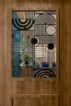 a wooden door with an abstract design on it