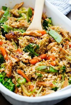 a white bowl filled with rice and vegetables