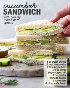 a sandwich with cream cheese and cucumber is stacked on top of each other