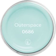 the outer space logo is shown in white on a light blue plate with silver rim