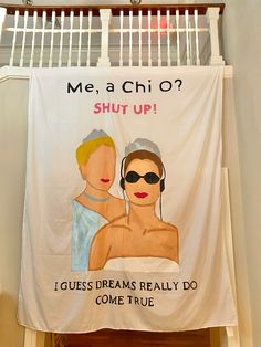 a banner hanging from the side of a building that reads, me, a chio? shut up i guess dreams really do come true