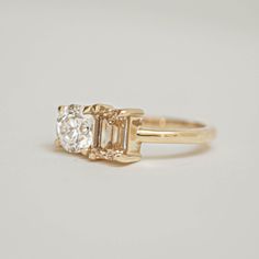 Item Details: One 1.00 ctw E color VS1 clarity lab-created old European cut diamond . One 1.03 ctw natural fine champagne emerald cut diamond VS clarity. The band is 1.85mm wide. This ring is created with one of a kind gemstones. Please allow 1-2 weeks for delivery. Berlinger Jewelry, Wide Engagement Ring, Mens Diamond Band, Wedding Band Engraving, Wedding Ring Styles, Wedding Day Jewelry, Emerald Cut Diamond, Engagement Rings For Men, European Cut Diamonds