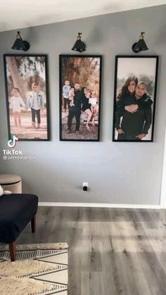 a living room with three pictures hanging on the wall and a couch in front of it