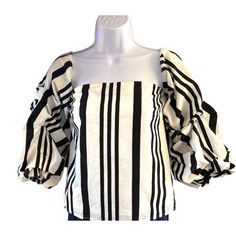 Elevate your wardrobe with this stylish Mare Mare x Anthropologie blouse. Featuring bold stripes and elegant puff sleeves, it effortlessly combines comfort and chic sophistication. * Bold black & white stripes * Elegant puff sleeves * Comfortable fit * Made from high-quality cotton & polyester * Size: M Style: Resort, Striped, Off the Shoulder Content: 100% Cotton Washing Instructions: Hand Wash Measurements: Armpit to armpit: 17" Back of Collar to Bottom Hem: 13 1/2" We ship most items out the Chic Vertical Stripes Top For Spring, Chic Tops With Vertical Stripes For Spring, Chic Fitted Vertical Stripes Tops, Summer Cotton Blouse With Striped Sleeves, Chic Fitted Top With Vertical Stripes, Chic Fitted Tops With Vertical Stripes, Elegant Tops With Vertical Stripes For Spring, Elegant Vertical Stripes Top For Spring, Striped Cotton Puff Sleeve Top