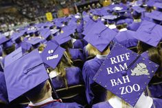 a group of graduates in purple caps and gowns with the words riff ram bah zoo on them