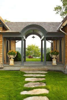 a stone path leads to the front door of a house