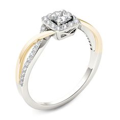 a white and yellow gold engagement ring with diamonds on the band, set in two tone gold