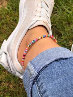 I love working with multi coloured vinyl disc beads. This one is made using 4mm African Vulcanite Vinyl Disc Beads. Mixed colours with the principal colour being pink and others include white, green, black, blue, red, orange & yellow disc beads. Your ankle bracelet will have these colours but not necessarily in the specific order of the ankle bracelet pictured. I put these disc beads on in any order. They are so tiny and fiddly I would be driven mad if I created a particular pattern I like the mixed up look not a formation. Hailing from the villages of West Africa, these brightly coloured discs are modelled after traditional Ghanaian Coconut Beads. Also known as African Vulcanite beads because they were originally made from vulcanized rubber, now they are more commonly made from using recy Vinyl Disc, Beach Jewellery, Surf Jewelry, Silver Ankle Bracelet, Beading Cord, Anklets Boho, Bohemian Jewellery, Chakra Jewelry, Beaded Anklets