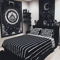 black and white bedroom with two wall hangings